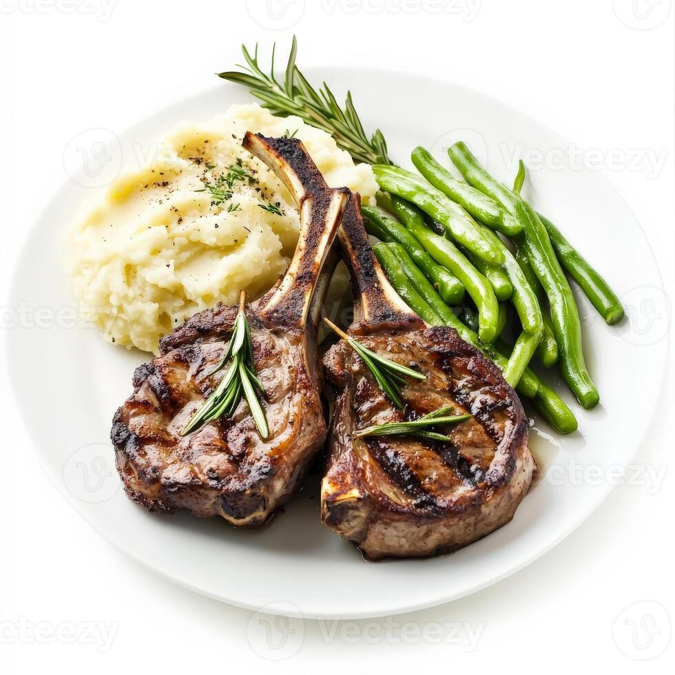 Grilled lamb chops with mashed potatoes and green beans on a white plate photo