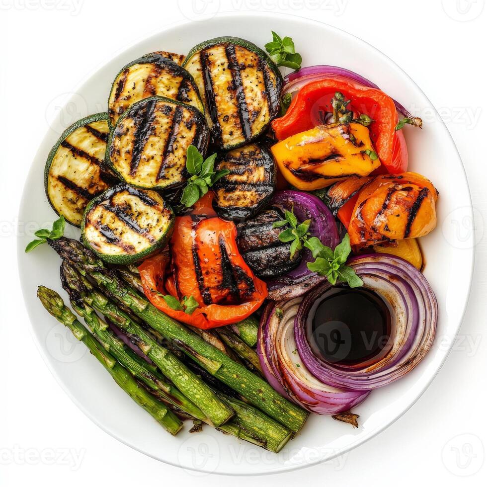 A vibrant platter of mixed grilled vegetables, featuring zucchini, eggplant, bell peppers, asparagus, and red onions, marinated in olive oil and herbs, and grilled until tender and slightly charred, photo