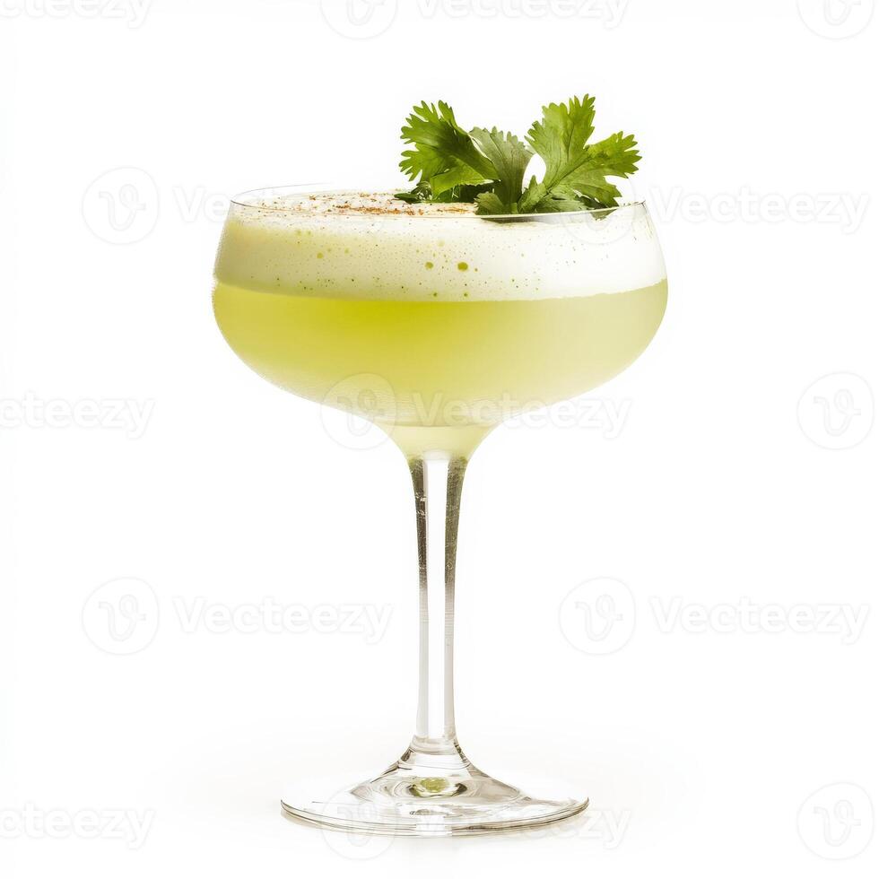 A green cocktail with a garnish on top photo