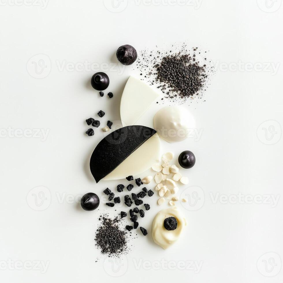 A monochromatic composition, ingredients all in shades of a single color, such as black or white, creating a dramatic and minimalist effect, a bold artistic statement in food presentation, isolated on clean white background. photo