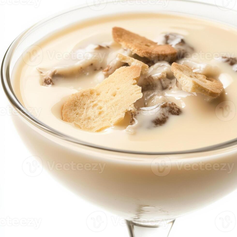 A close-up of a creamy zuppa di funghi dessert, a warm and comforting Italian dessert, with a smooth and creamy custard base, made with heavy cream, sugar, egg yolks, and Marsala wine, flavored with vanilla and served warm in a glass, garnished with ladyf photo