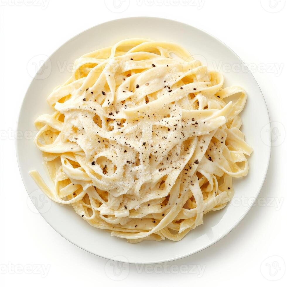 A plate of fresh fettuccine alfredo, with wide, flat noodles tossed in a creamy sauce made with butter, parmesan cheese, and heavy cream, garnished with freshly grated parmesan cheese and a sprinkle of black pepper, isolated on clean white background. photo
