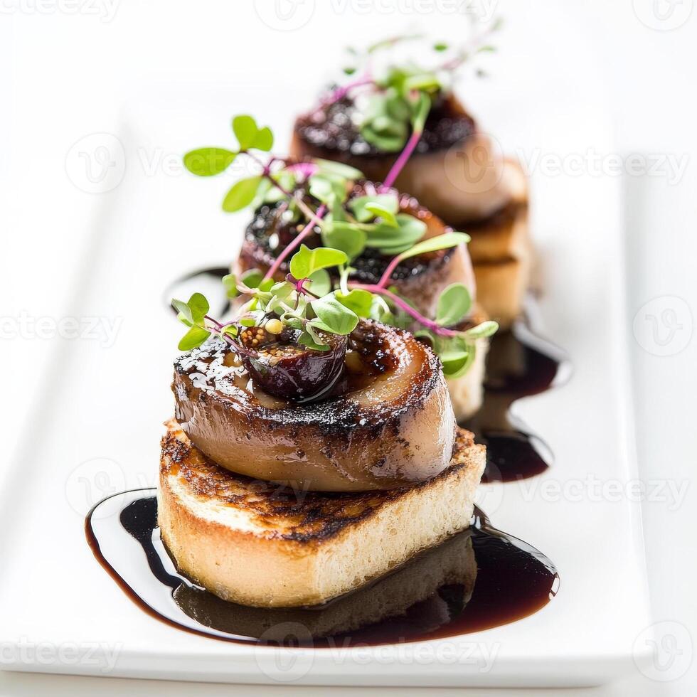 A plate of pan-seared foie gras, served with a fig jam, brioche toast, and a balsamic reduction, garnished with microgreens, highlighting the richness and delicacy of this luxurious ingredient, with a focus on contrasting flavors and textures, perfect for photo