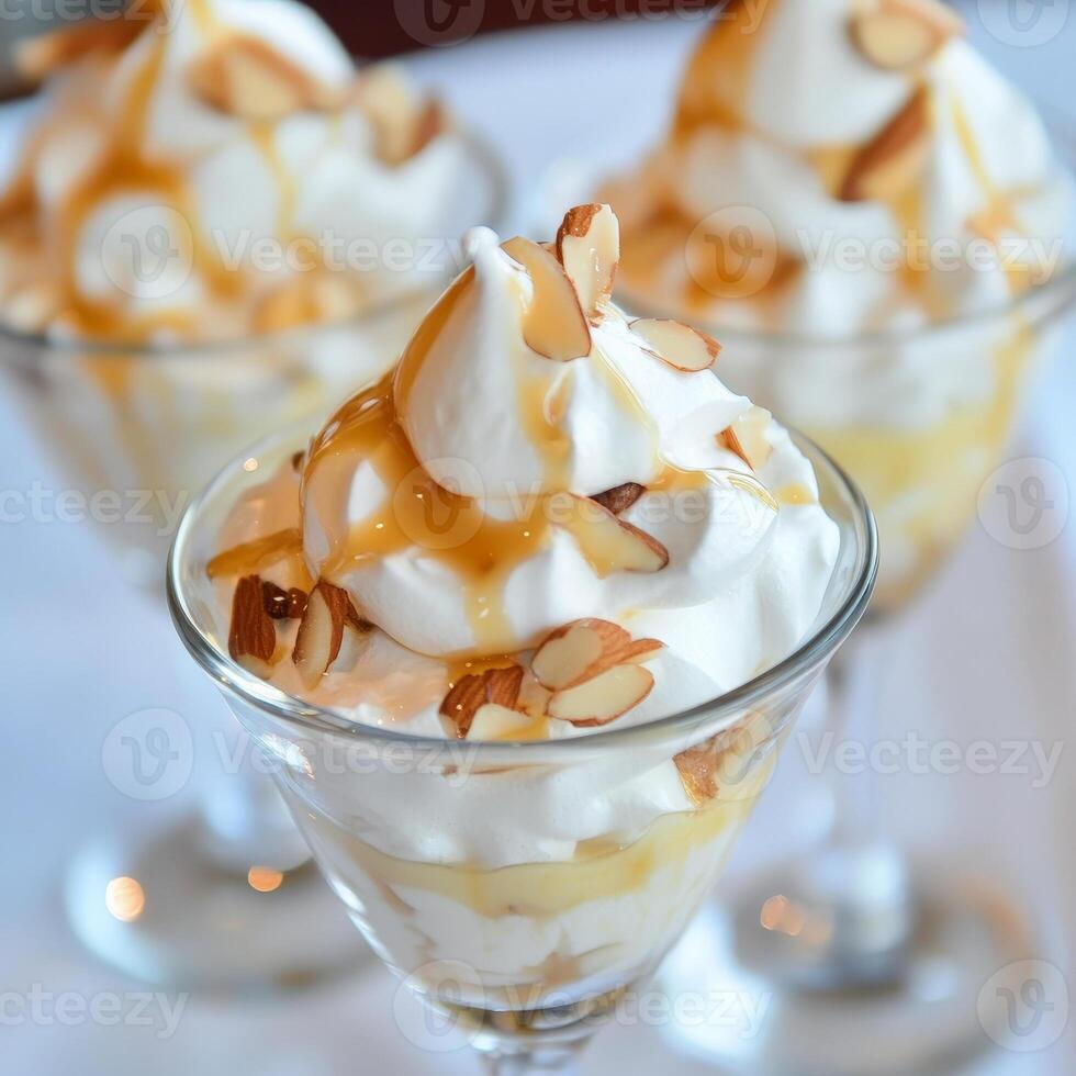 Three dessert glasses with whipped cream and nuts photo