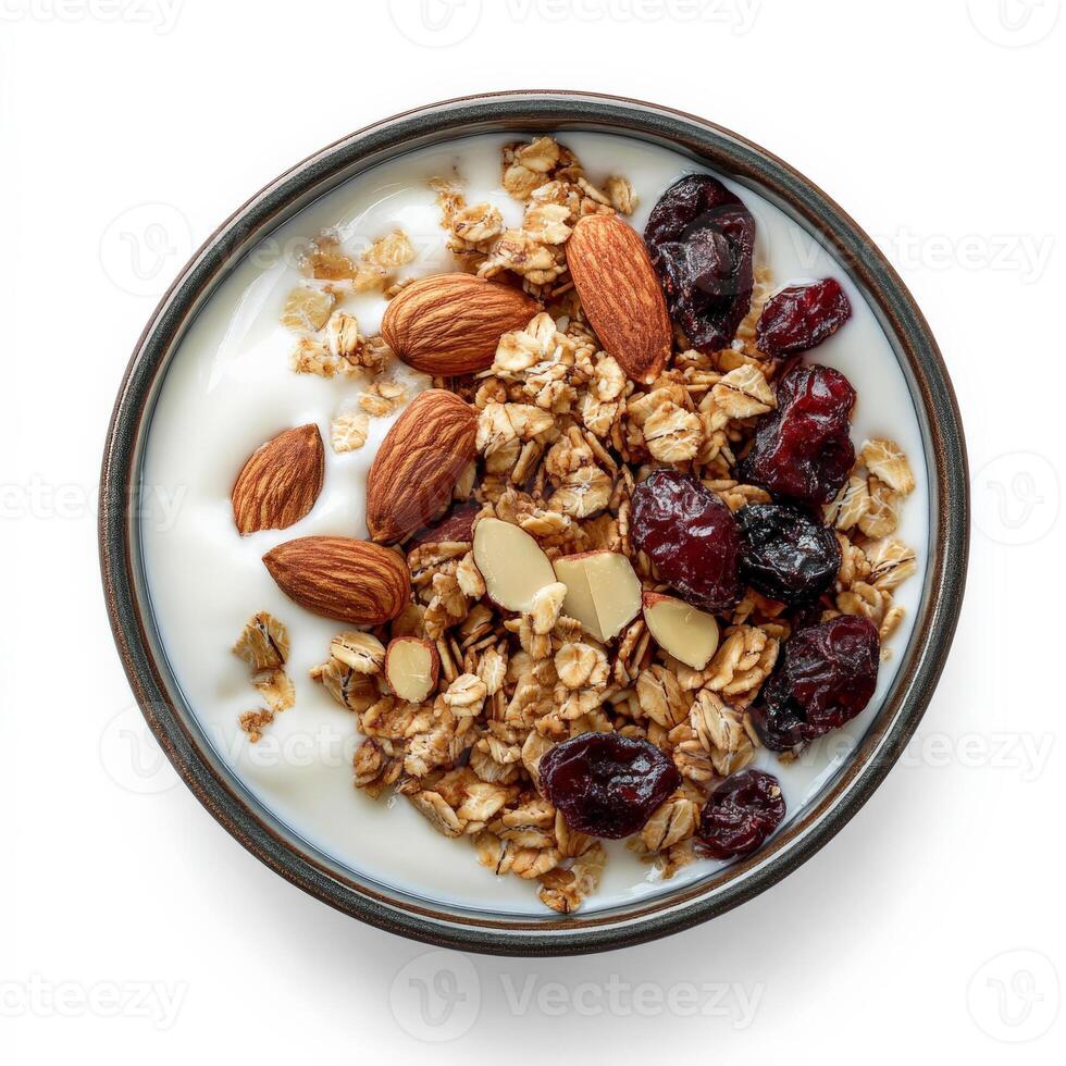 Granola with yogurt, almonds and cranberries in a bowl on a white background photo