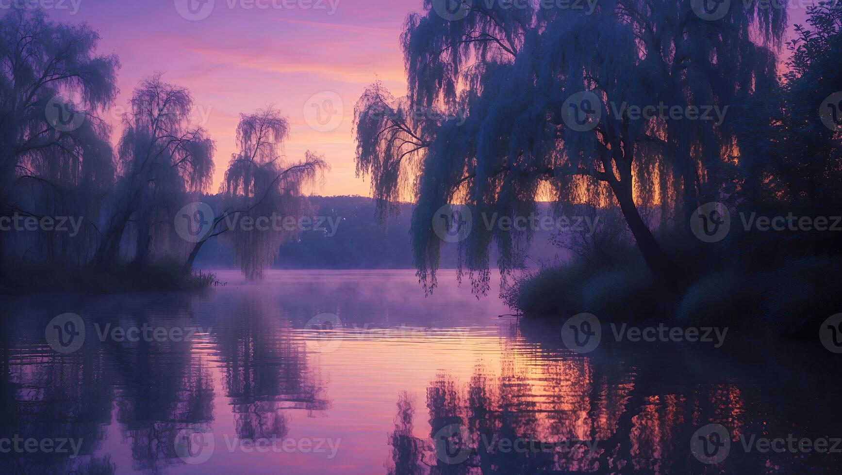 Reflecting Trees at Lake at Sunset with Colorful Sky and Mist photo