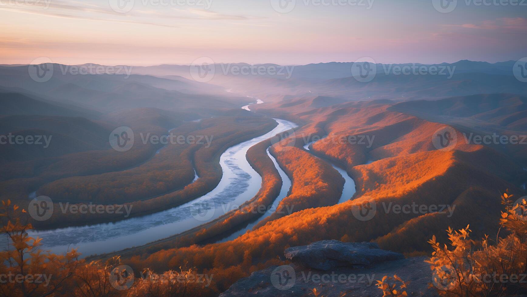 Scenic River Bends Through Mountainous Terrain at Sunset with Golden Light photo