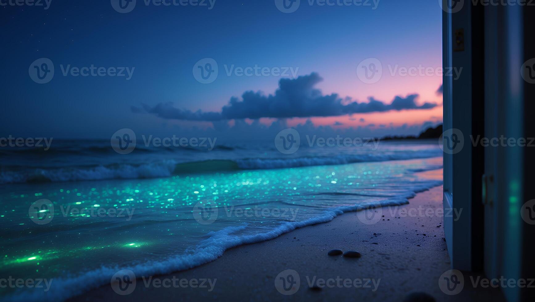 Glowing Waves on Beach at Twilight Seen Through Open Doorway photo