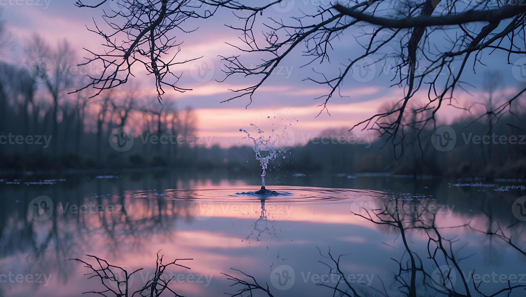 Water Droplet in Calm Lake Reflecting Pink Sky photo