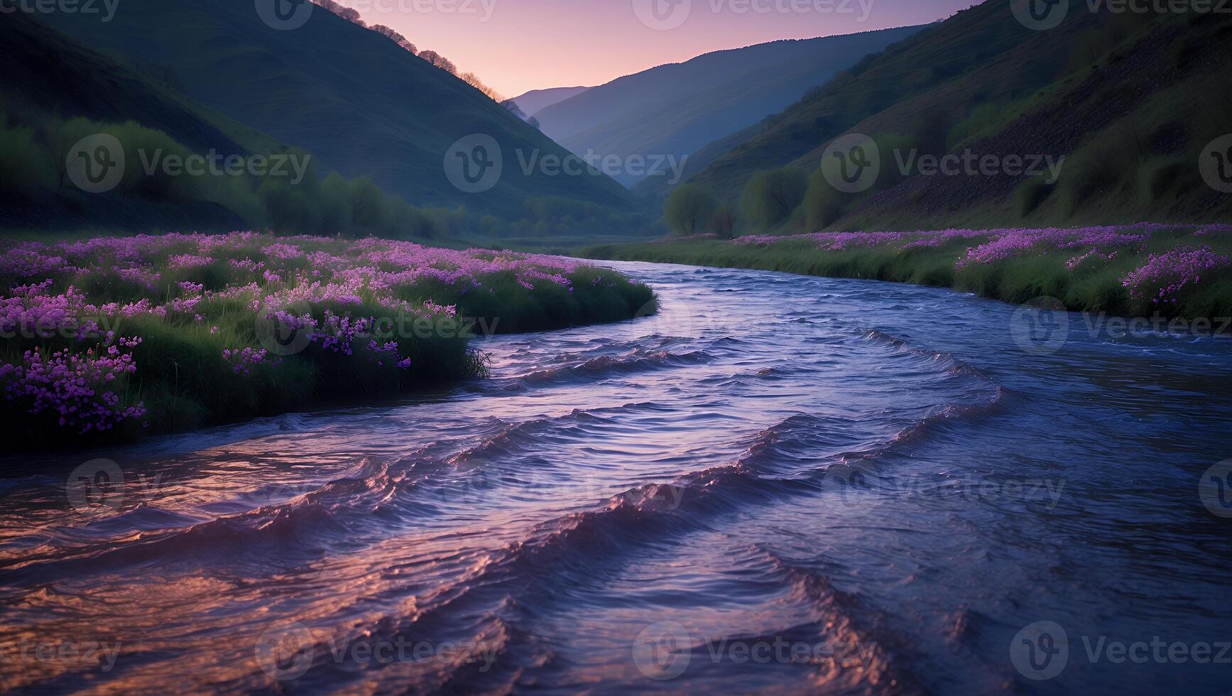 River Flows Through Mountain Valley with Blooming Meadow photo