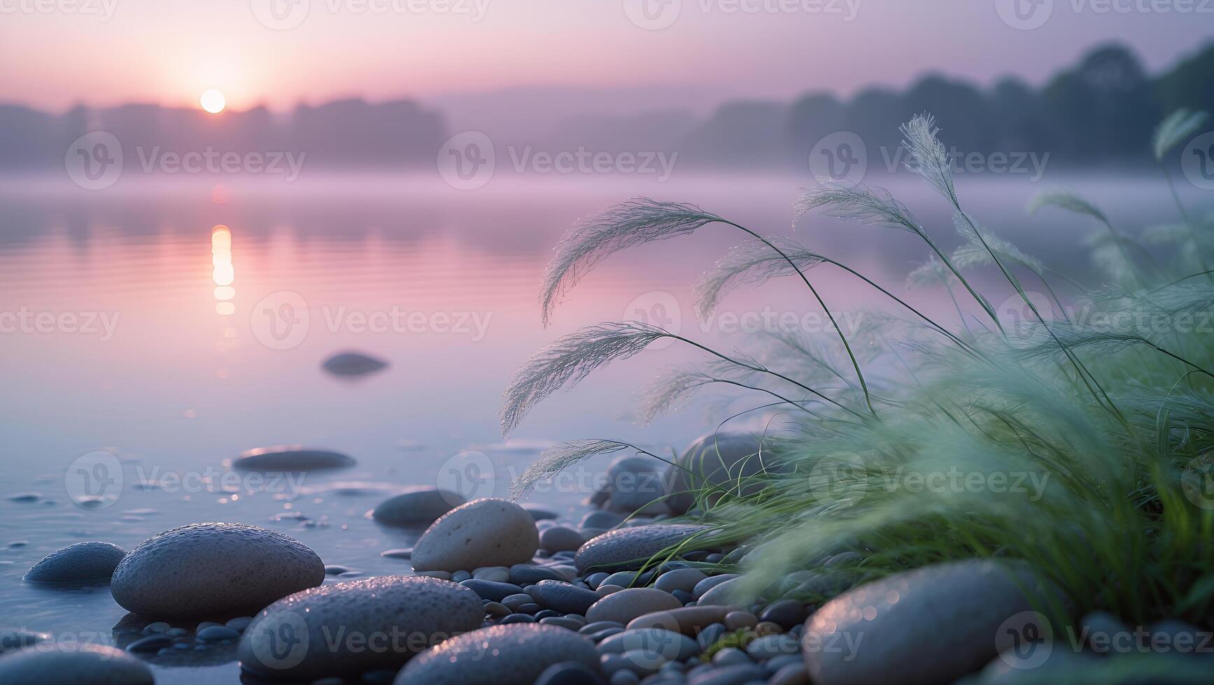 Calm Lake at Sunrise with Rocks and Grass on Shore photo