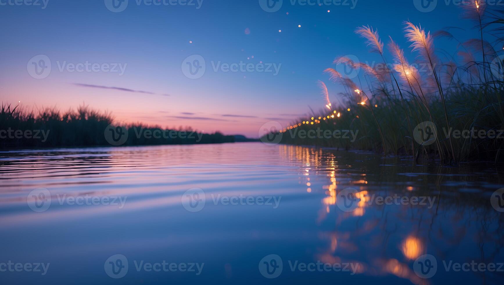 Calm River at Twilight with Grass and Reflecting Lights photo