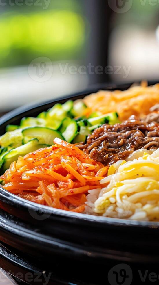 Close up Bibimbap, mixed rice with colorful toppings. Healthy meal. Blurred garden background, editorial photo