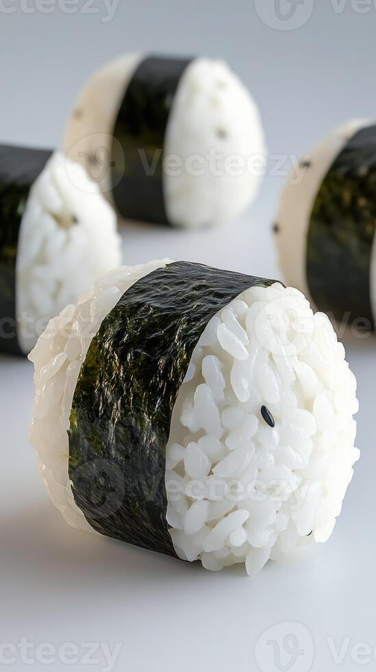 Close-up of rice balls with nori seaweed in a plain background. Food concept photo