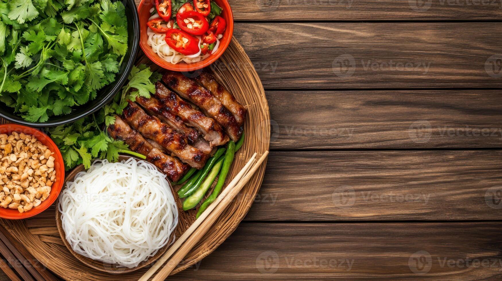 Grilled meat and noodles with fresh herbs on a wooden plate, top view, use in restaurant menus photo
