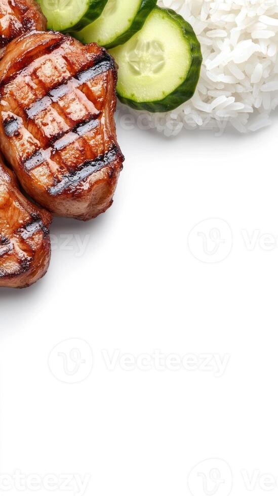 Grilled beef with cucumbers and rice on a white background for healthy eating concept photo