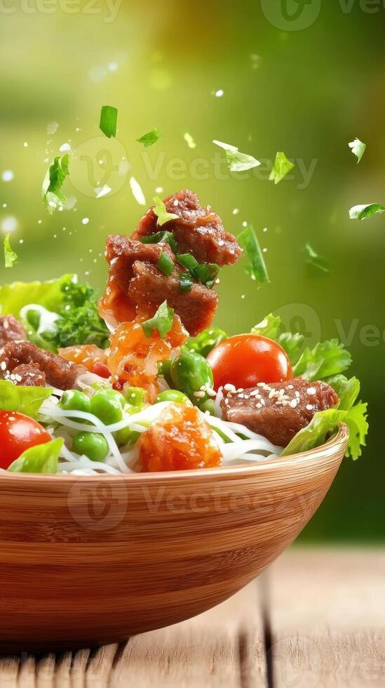 Healthy salad with meat rice noodles in a wooden bowl, outdoors, sunny. Possible restaurant promo photo