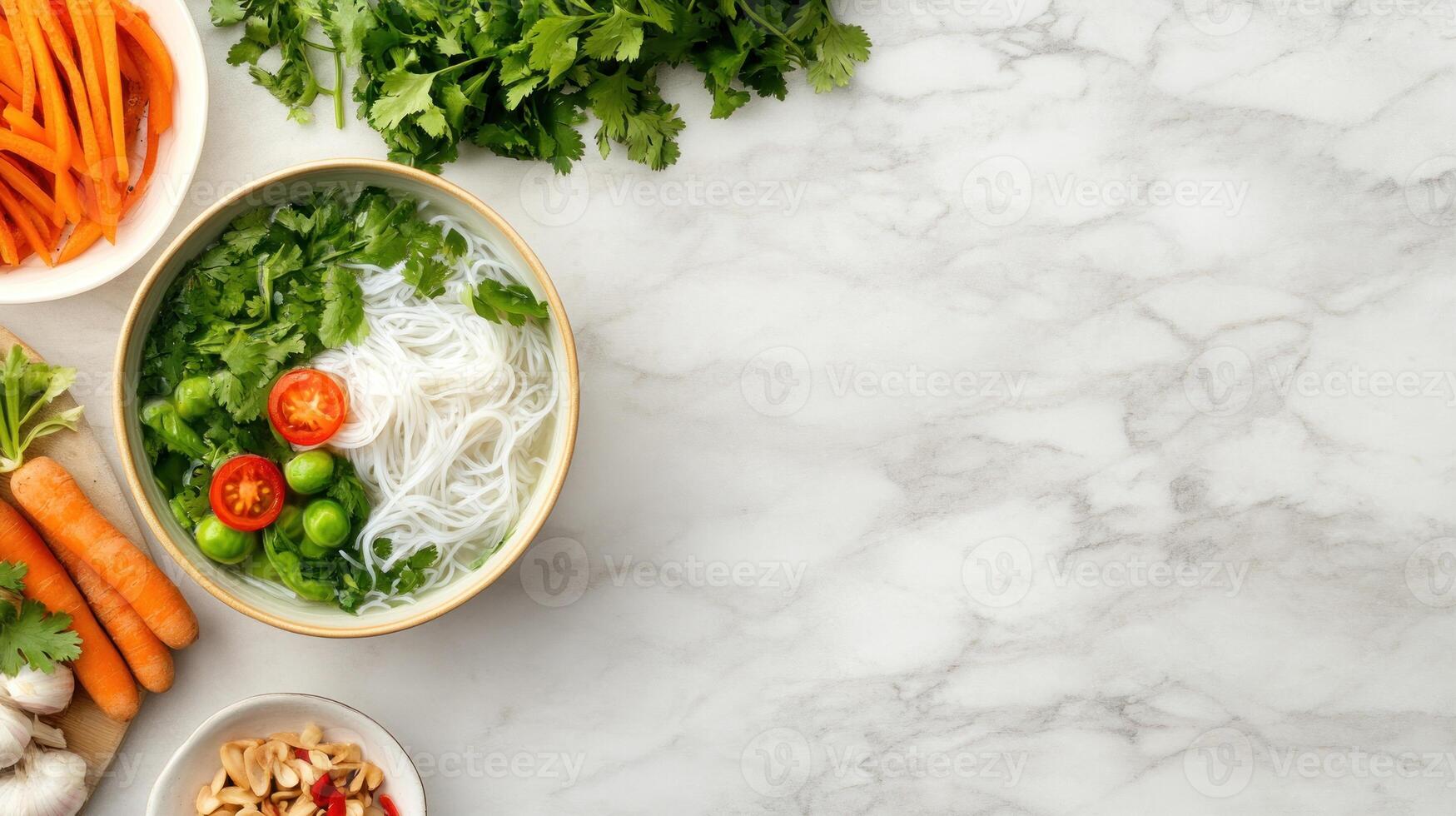 Rice noodle soup with vegetables on marble background. Food photography or recipe illustration photo