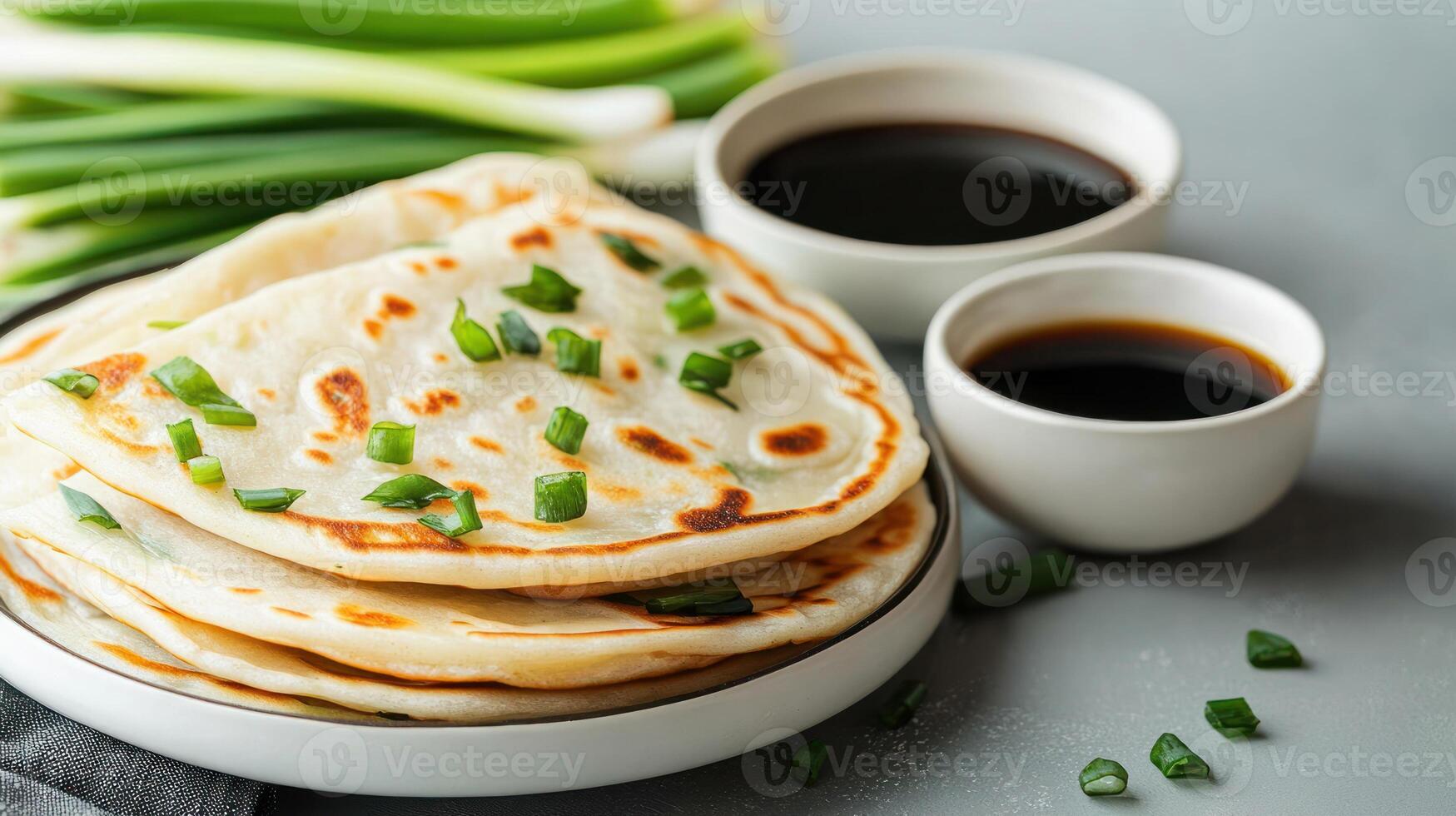 Scallion pancakes with soy sauce, top view, on table, food photography for cooking website photo