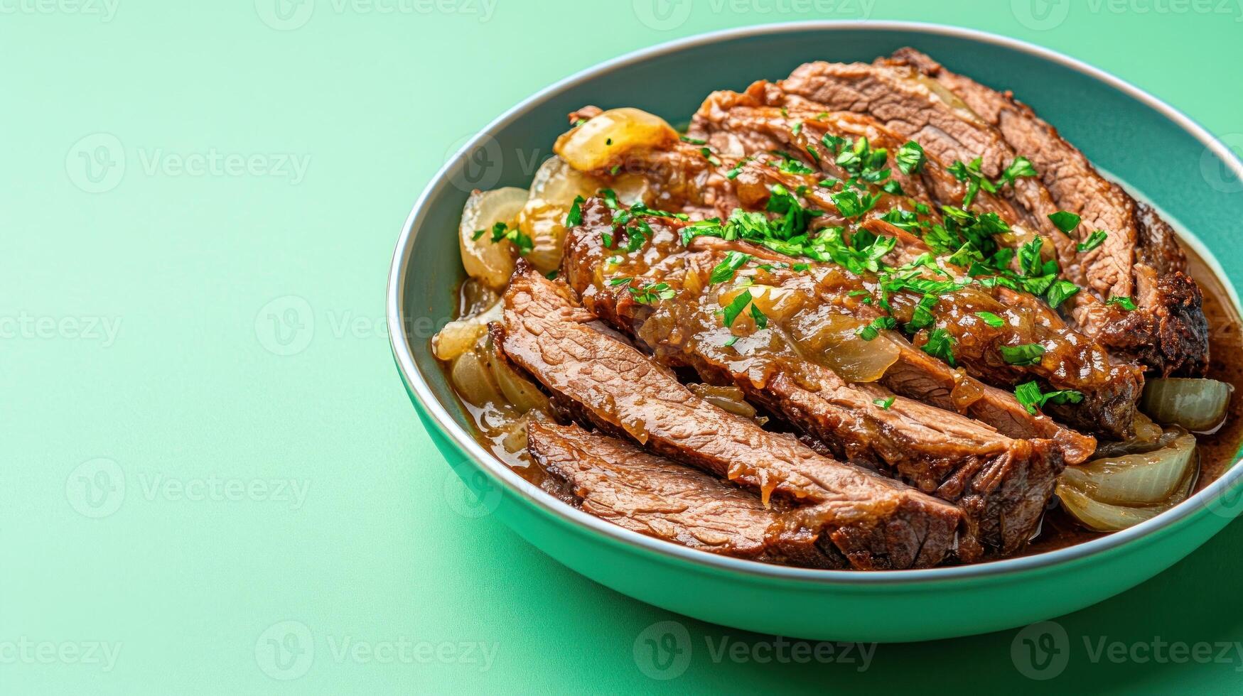 Sliced brisket with onions herbs in bowl, green backdrop. Menu pic, recipe book photo
