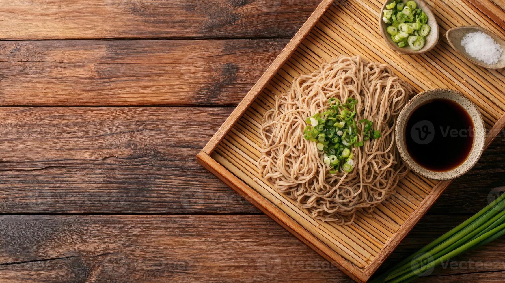 Soba noodles with soy and greens on bamboo tray with wood background. Possible culinary stock image photo