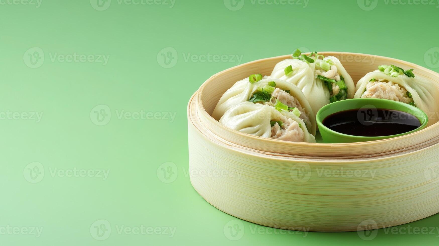 Steamed beef buns are in a wooden steamer with soy sauce on a green background. Food photography photo