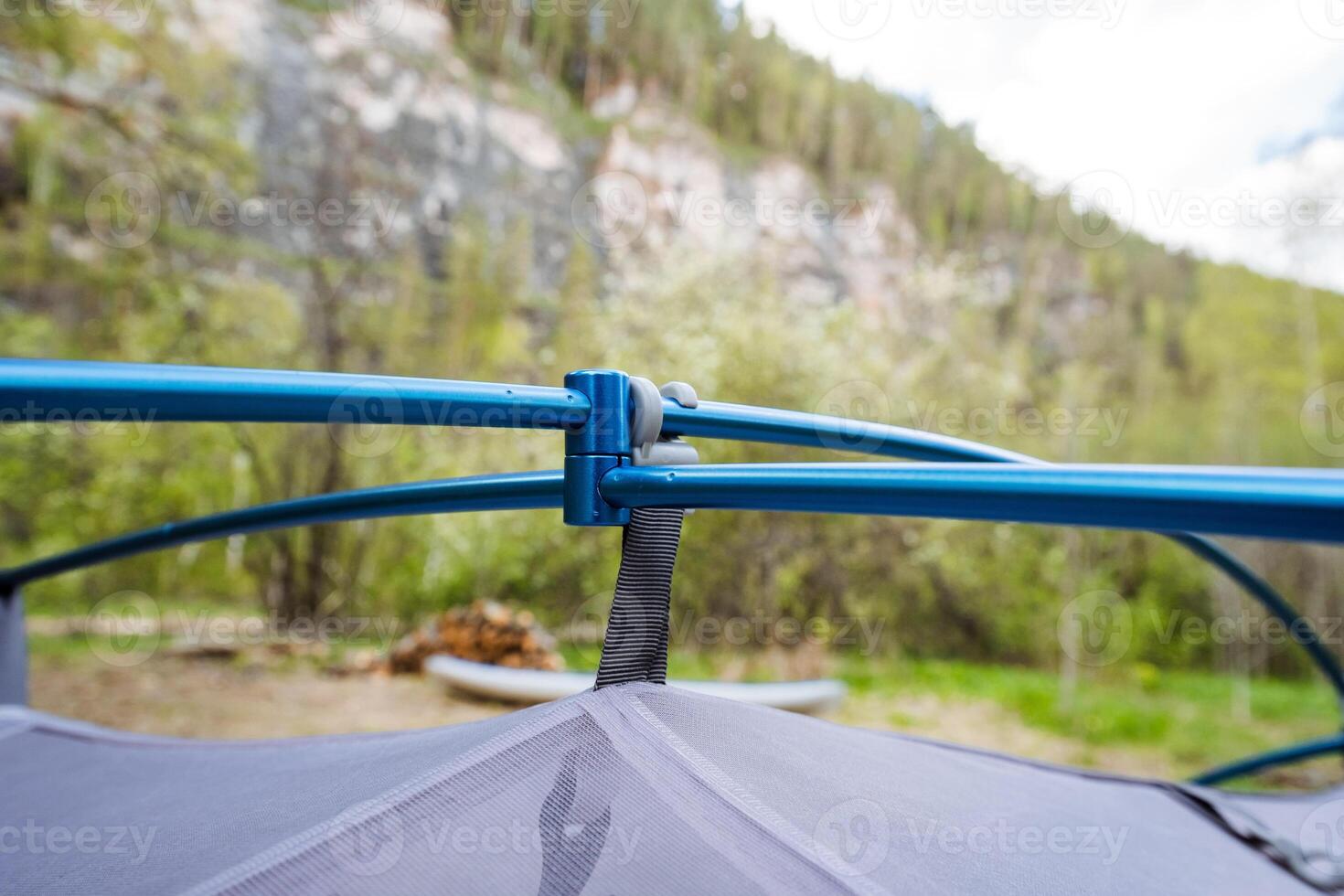 A CloseUp View of a Tent Canopy and Its Support Structure Nestled Within a Beautiful Natural Setting, Perfectly Capturing the Essence of Outdoor Adventures and Camping Experiences photo