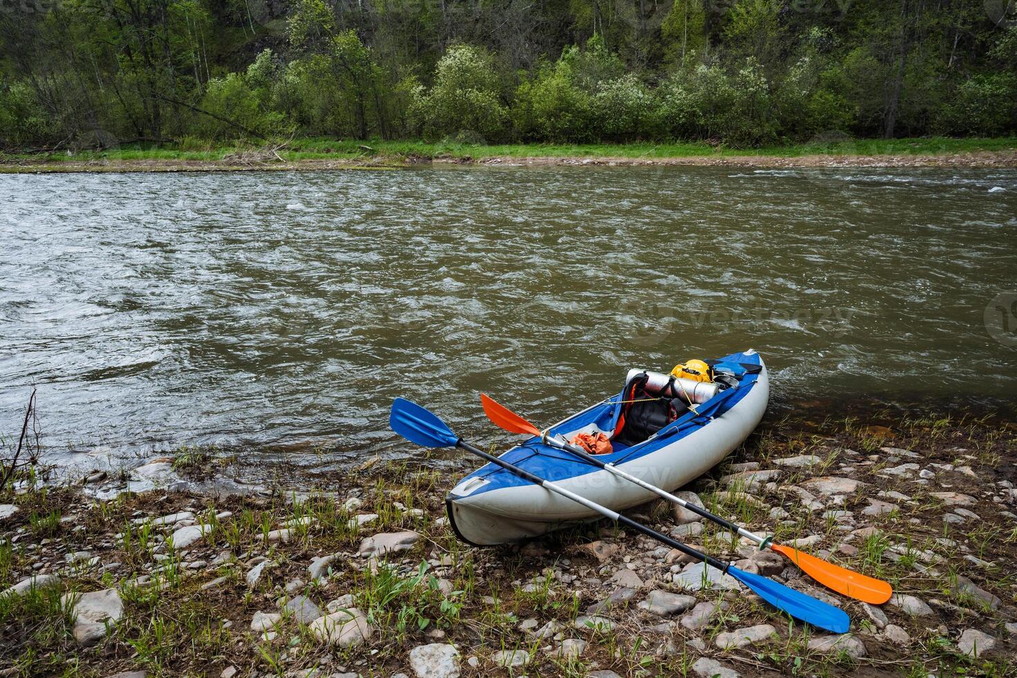 Embark on a peaceful and tranquil kayaking adventure along the river, where you can escape into the beauty of nature, reconnect with friends, and immerse yourself in verdant greenery all around photo