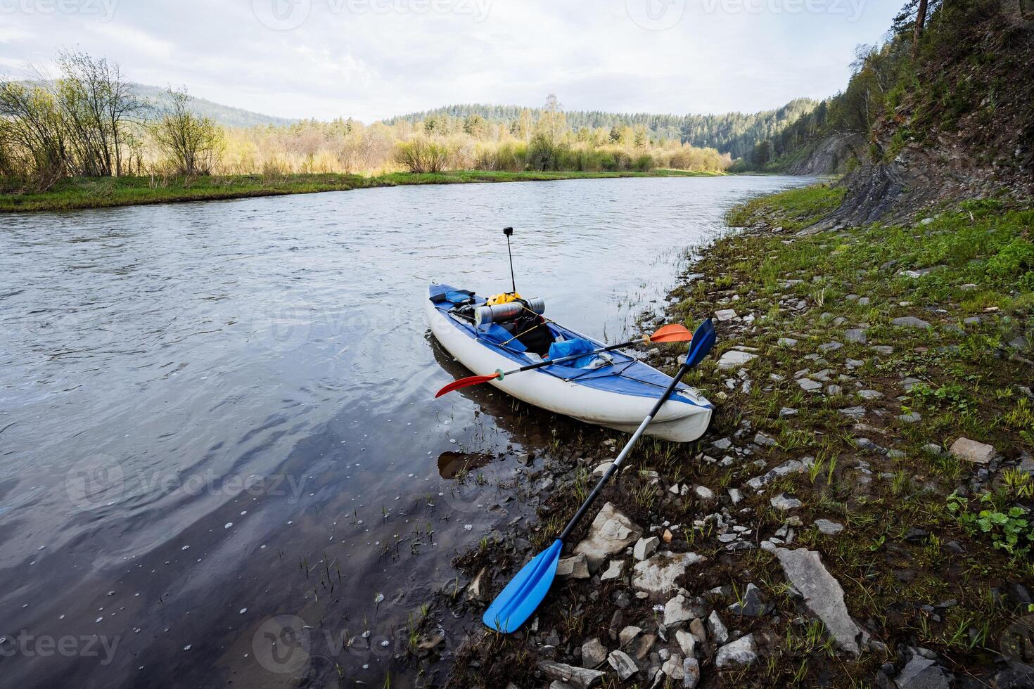 Enjoy a serene kayaking trip on a calm river, amidst lush landscapes, wildlife, and peaceful reflections. Paddle through the scenic waterway to explore the vibrant coastal ecosystem photo