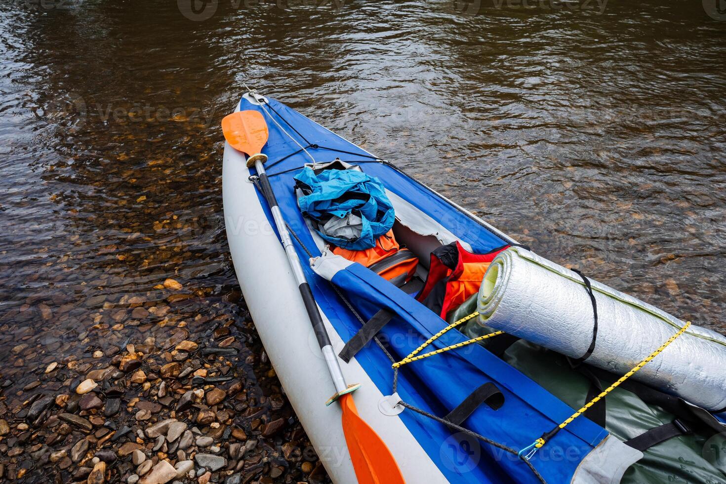 Imagine a colorful kayak gliding on calm river waters, ready for adventure. This scene captures the thrill of exploration and fulfills every adventurers dream of excitement and discovery photo