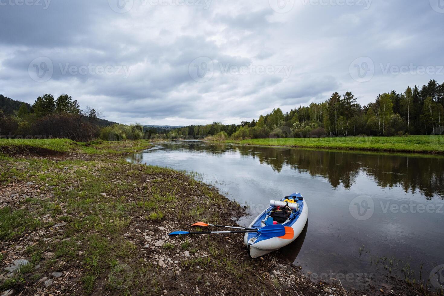 Experience kayaking on a calm river, surrounded by lush greenery and changing skies that inspire peace and wonder for nature lovers and adventurers, creating an unforgettable journey photo