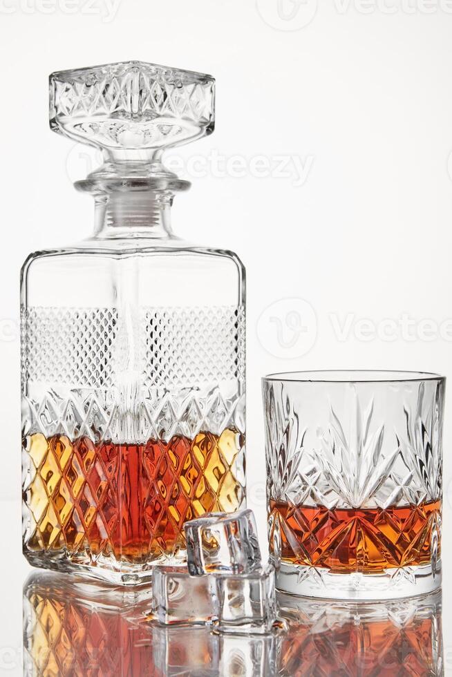 Scotch with ice cubes in glassware. Alcoholic drink. photo
