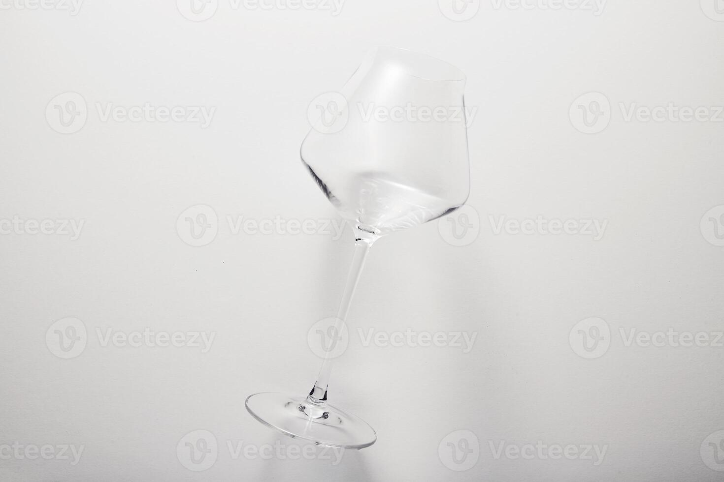 Empty transparent glass on thin stem for wine. photo