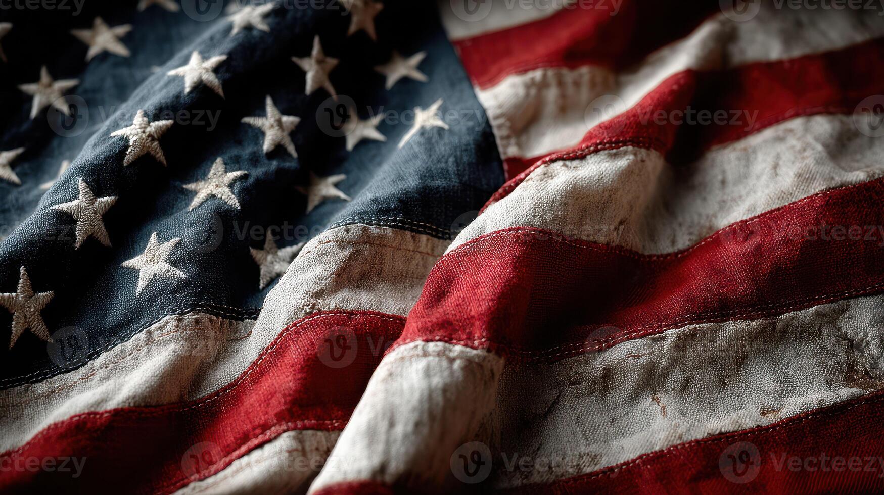 Old American flag with a worn texture waving gently under soft light in a cozy setting photo