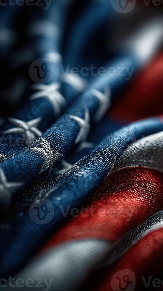 Textile details of a gently folded American flag showing vibrant colors and intricate stitching photo