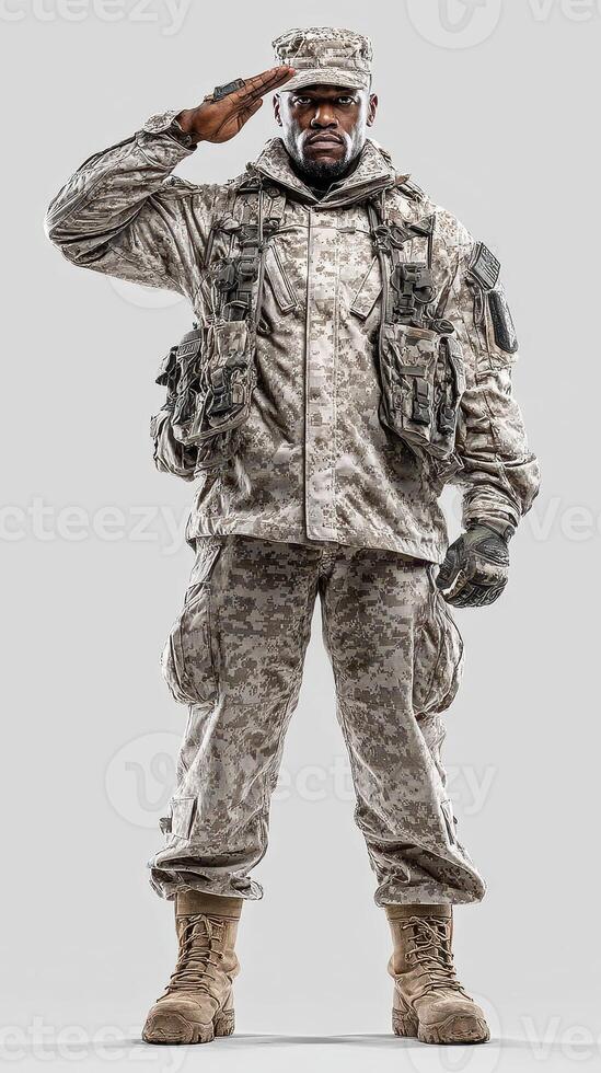 Soldier in camouflage uniform standing tall and saluting with pride in a neutral background photo