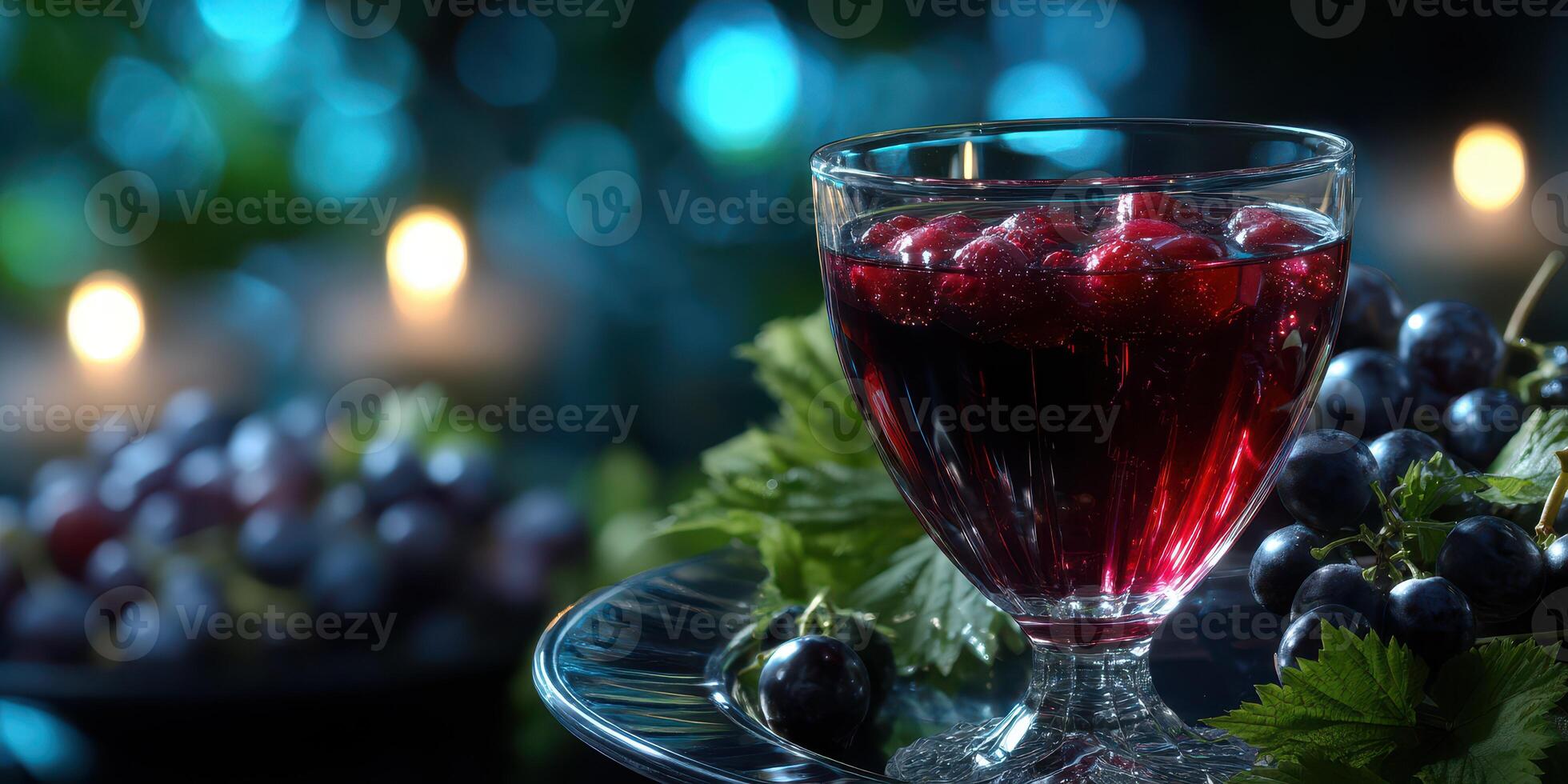Refreshing red drink with berries served in a glass on a dark table with soft candlelight photo
