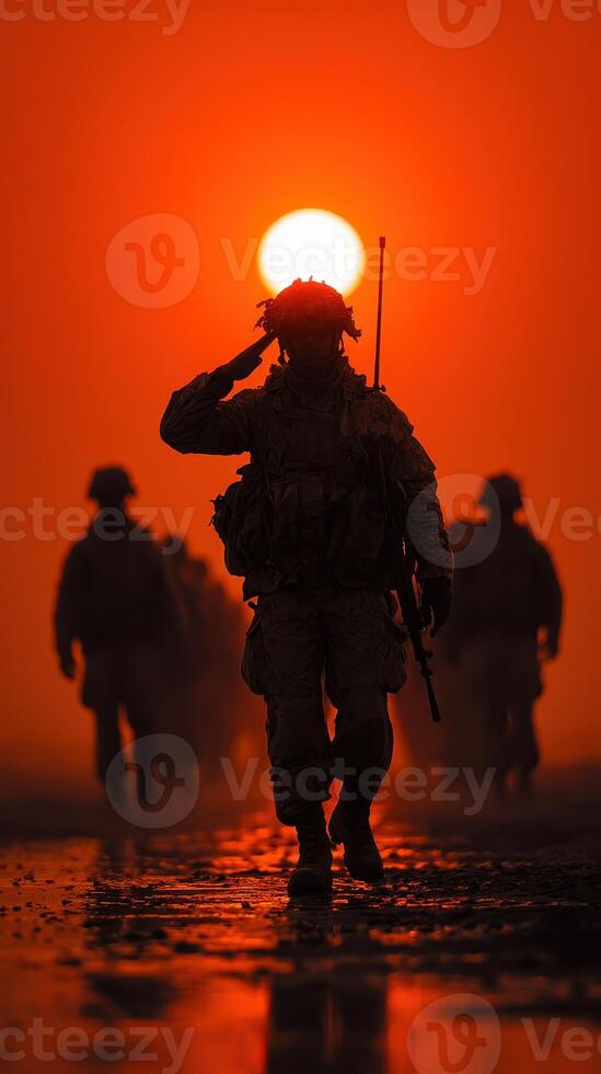 Soldiers salute at sunset during a military operation in a desert environment, honoring fallen comrades photo
