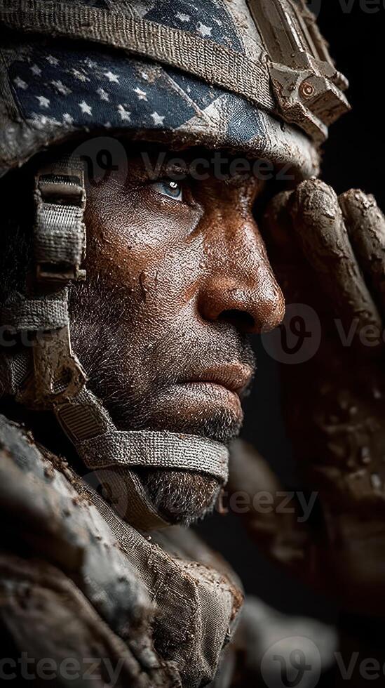 Soldier saluting in military gear with intense expression and rugged terrain in the background during a somber moment photo