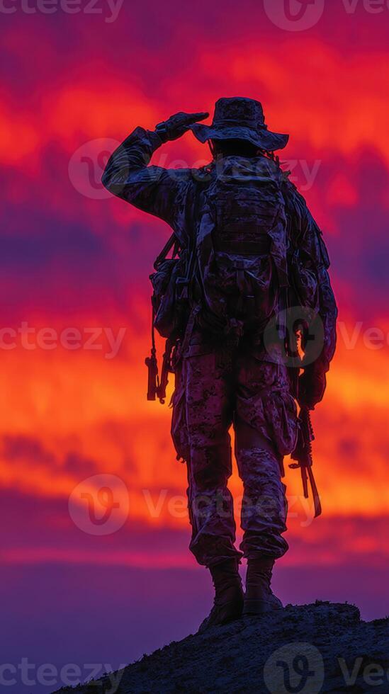 Soldier salutes against a breathtaking sunset backdrop highlighting courage and dedication in military service photo