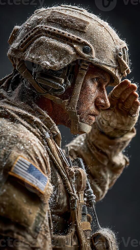 Soldier in tactical gear salutes amid snow, reflecting determination and strength in a cold environment photo