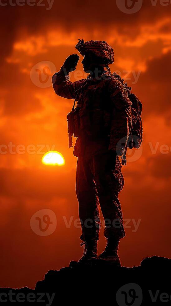 Soldier saluting at sunset over a dramatic skyline displaying courage and dedication photo