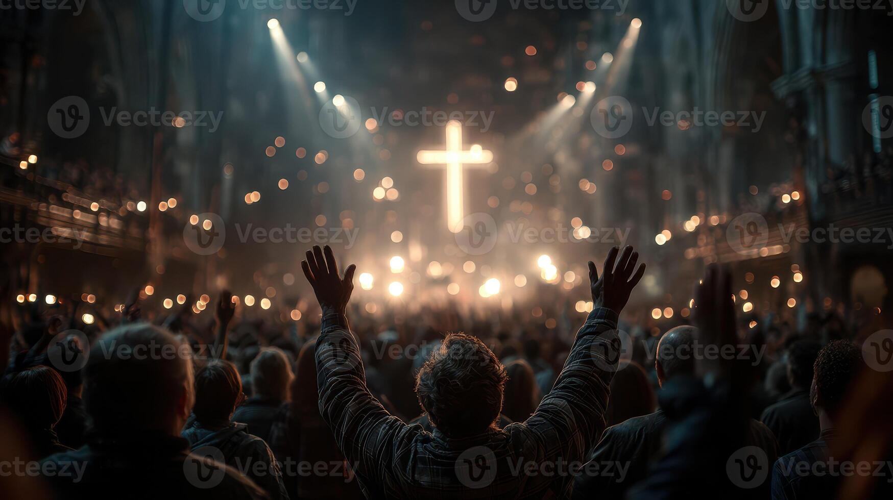 Crowd worships in a grand cathedral during an evening service with glowing cross photo
