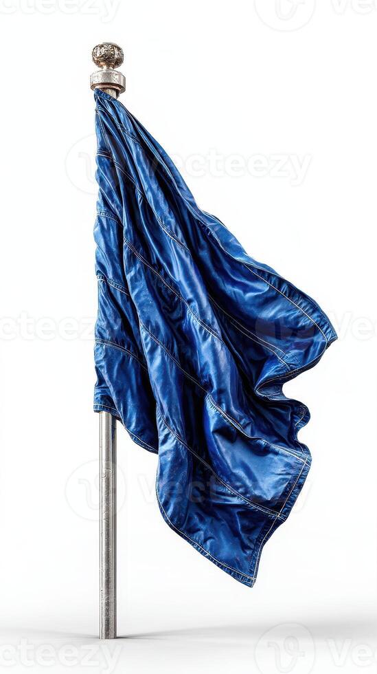 Beautiful blue flag waving gently on a silver pole against a plain background photo