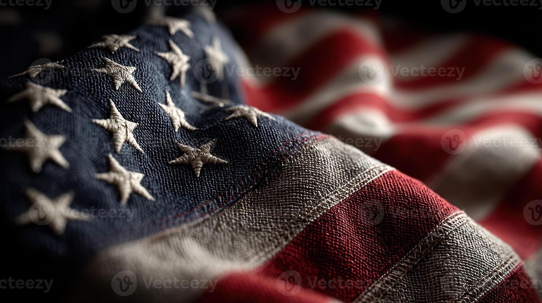 Close-up view of a weathered American flag displaying rich colors and texture in natural light photo