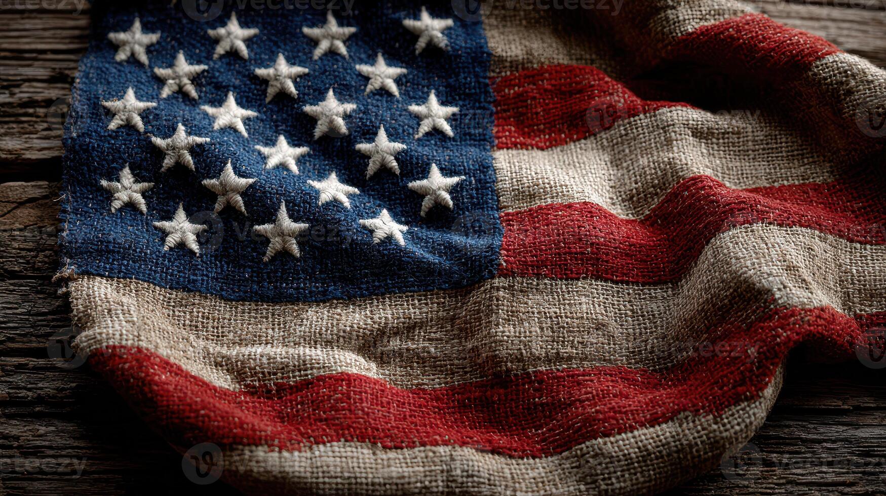 Vintage American flag made of textile draped on wooden surface with rustic texture showcasing intricate details and craftsmanship photo