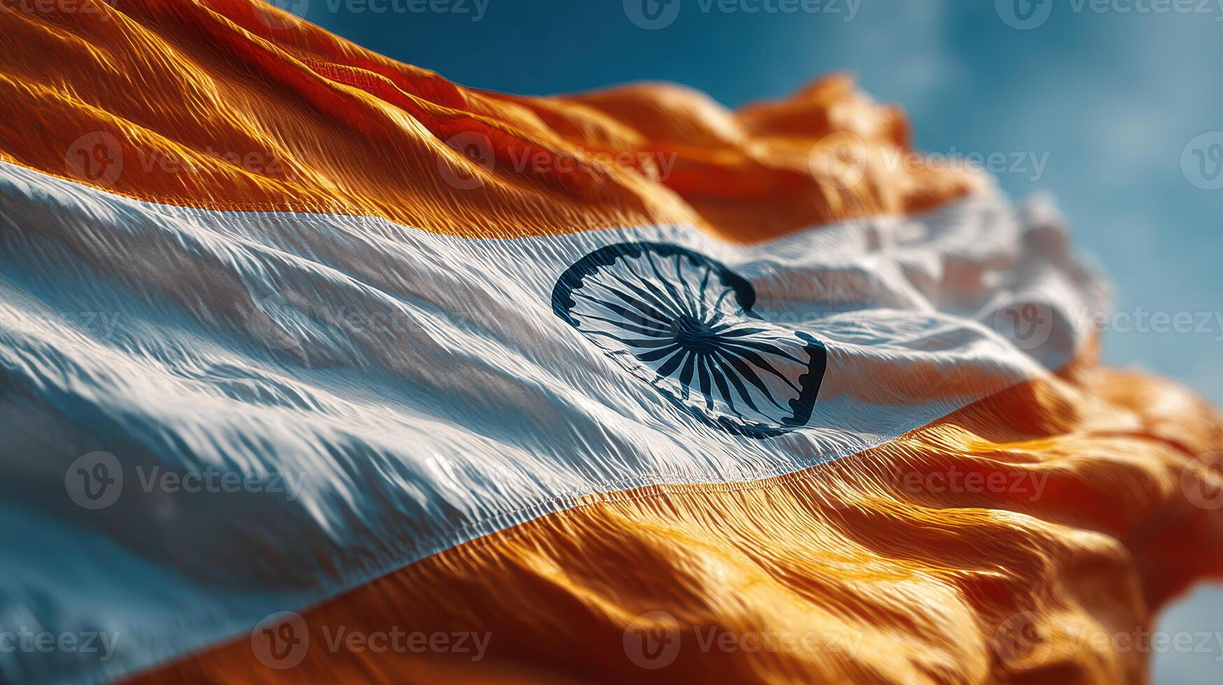 Indian flag waving brightly in the blue sky on a sunny day, symbolizing national pride and unity among citizens photo