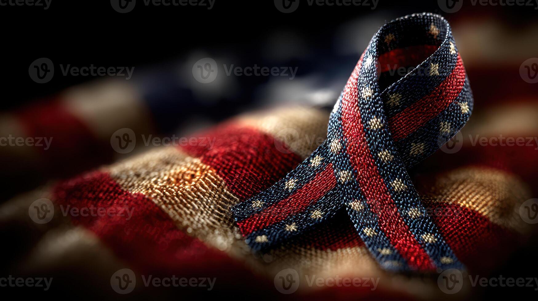 Red, white, and blue ribbon on a fabric background showcasing patriotism and national pride during a solemn occasion photo
