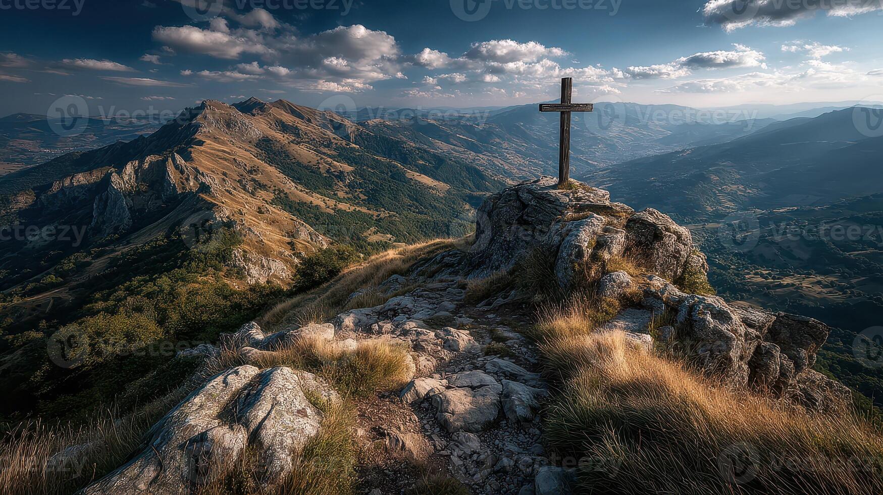 Majestic mountain view with a cross at sunset in an elevated landscape photo
