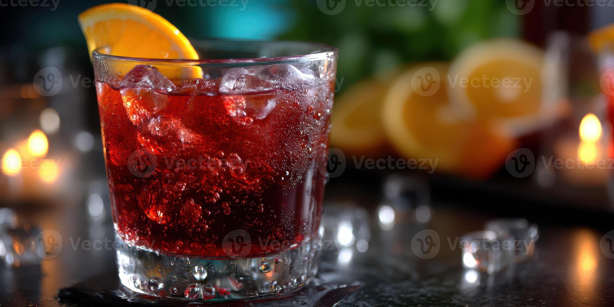 Refreshing cocktail served in a glass with ice and orange slice at a cozy evening gathering photo